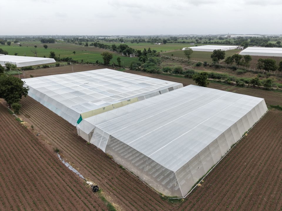 A pair of Avishkar Agribiz protected cultivation structures from above
